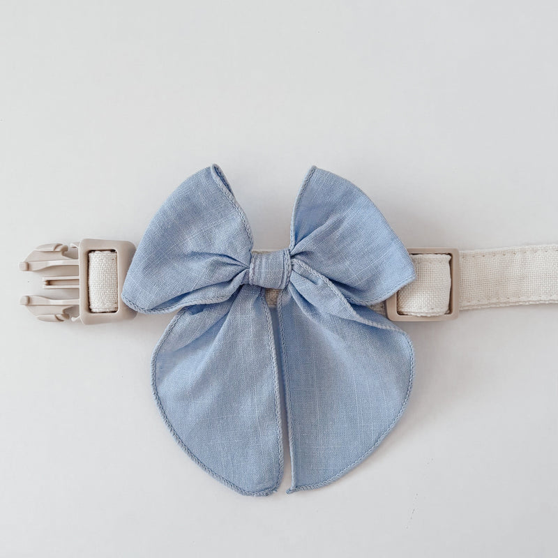 light blue dog bow on beige dog collar